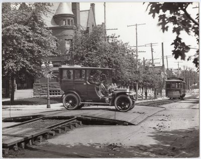 Packard Limousine Crossing the Streetcar Tracks at Lindell Boulevard and Boyle Avenue by Charles Clement Holt
